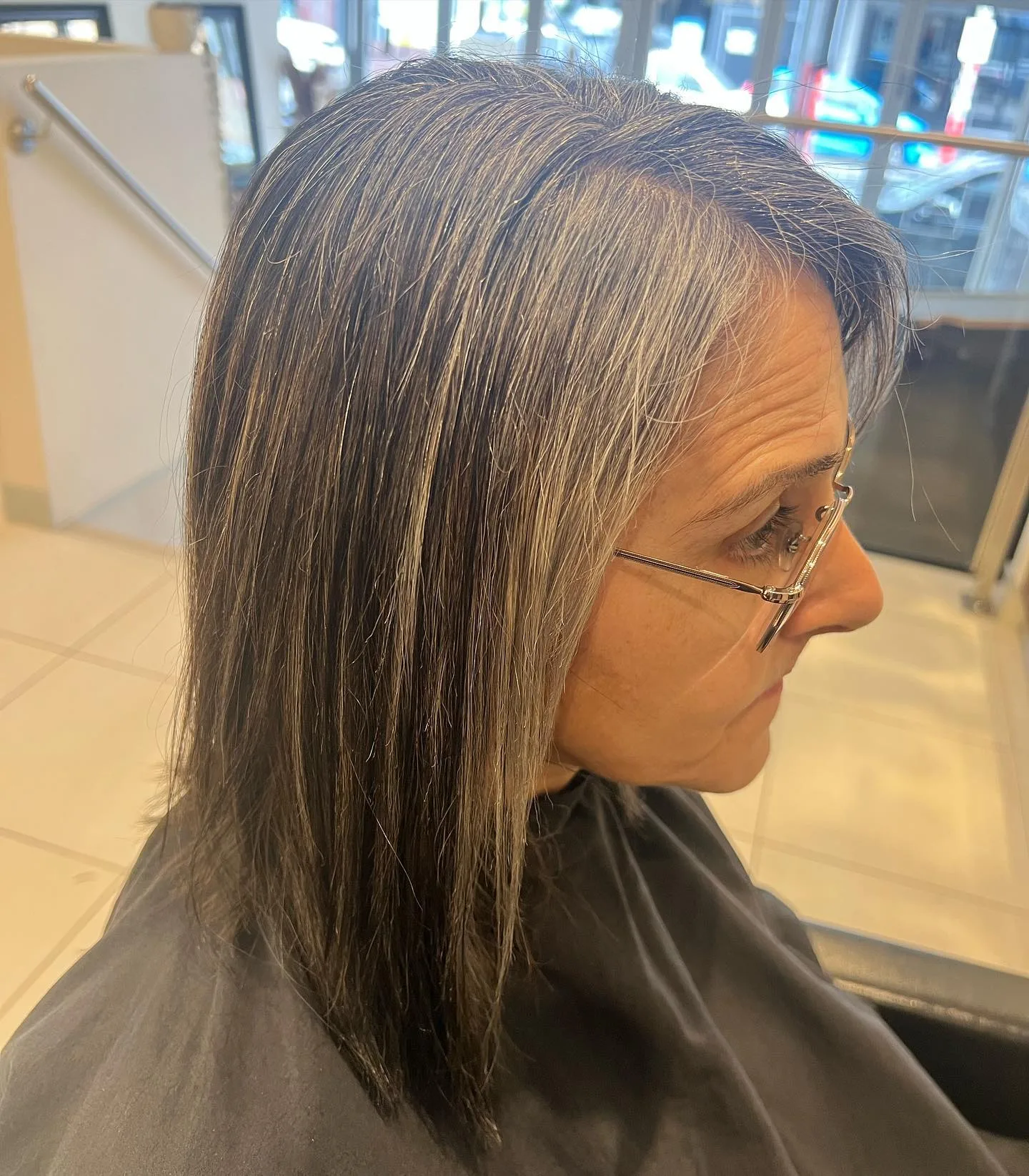Client showing finished grey and silver colour with foils at the Raw Edge shopfront window
