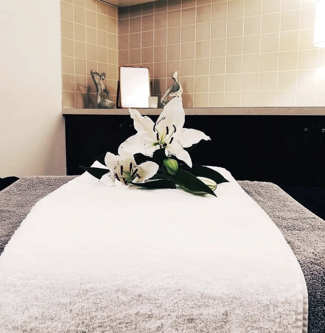 Beauty treatment room with white lilies at Raw Edge